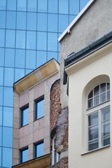 Architecture old and new city collage. Facades of old and new buildings. Blue glass and old red brick in architecture 