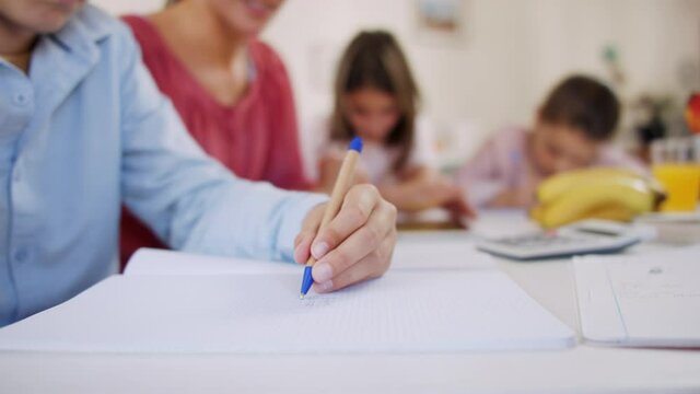 Group of homeschooling children with teacher studying indoors, coronavirus concept.
