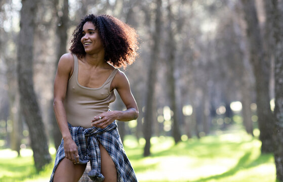 Young woman dancing in forest