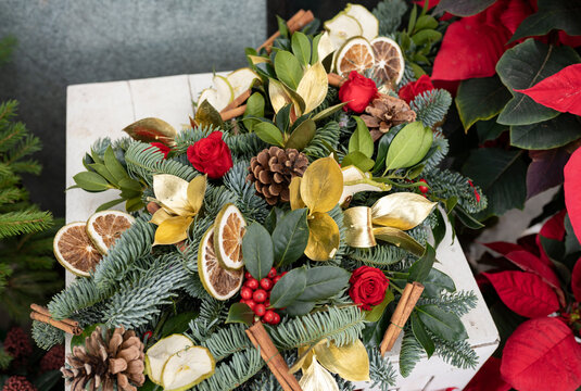 Christmas decoration with flowers and orange slices in flower shop