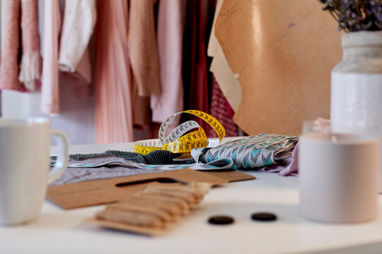 Tape measure with textile on desk in design studio