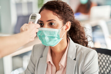 Employee going through mandatory temperature checks in office, Poland, podkarpackie, Dƒôbica