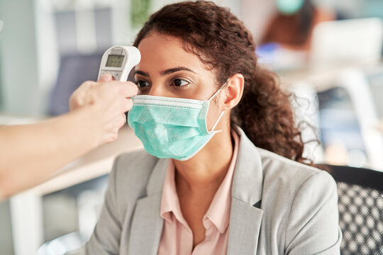 Employee going through mandatory temperature checks in office, Poland, podkarpackie, Dƒôbica - Powered by Adobe
