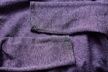 Naklejka premium lilac fabric texture of dirty clothing sweater with two sleeves