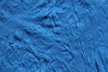 dark blue cloth background of crumpled matter on the part of old clothes