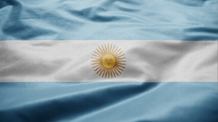 Argentinian flag waving in the wind. Close up of Argentine banner blowing silk.
