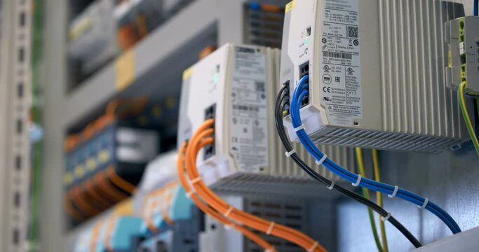 Electrical panel with many wires, electrical parts, automatic switches, breakers, residual current devices, fuses, terminals 