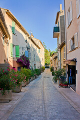 Fototapeta na wymiar Saint Tropez, Old city street view with colorful houses, Côte d'Azur. France, Europe