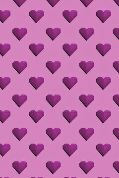 Magenta paper hearts on pink background