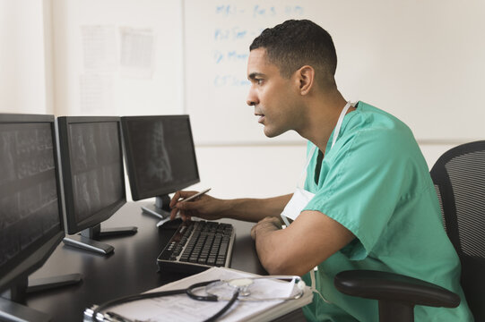 Surgeon working on computer