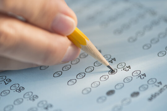 Close-up of hand filling out test