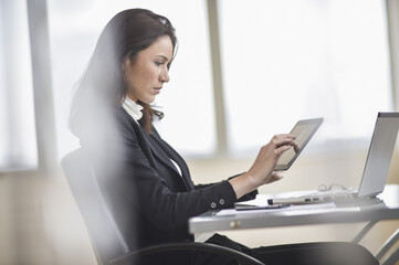 Businesswoman using tablet pc