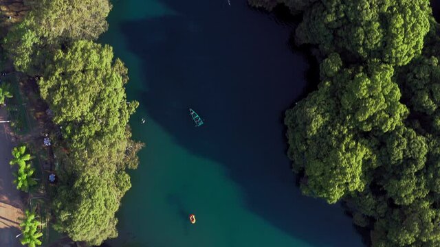 Aerial: people enjoying a day in the lake, drone view