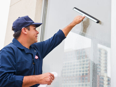 Man cleaning window