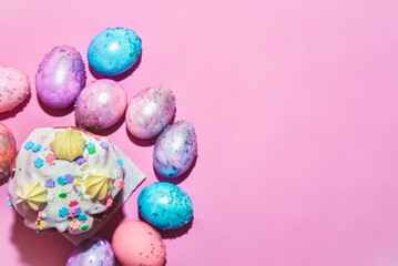 Easter eggs and orchid flower on a pink backdrop. Happy easter food and decorations, Orthodox easter celebration, spring theme, happy easter festive food  