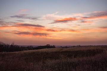 Romantic vanilla pink sky background, beautiful clouds, stunning views of the dramatic sunset sky, natural textured wallpaper.
