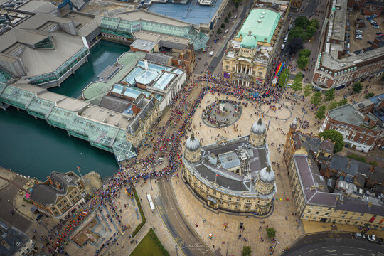 Aerial view of gay pride parade with people in Victoria Queen square of Hull downtown, United Kingdom.