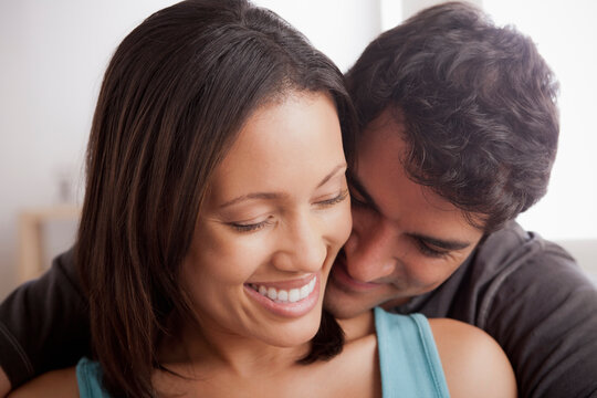 Smiling couple in close embrace