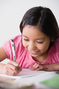 Boy (8-9) doing homework