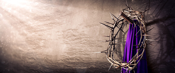 
Crown Of Thorns And Purple Robe Hanging On Nail In Stone Wall With Light Rays
 - Crucifixion Of Jesus Christ - obrazy, fototapety, plakaty