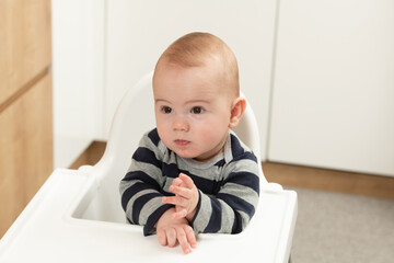 Child Sitting at Empty Table