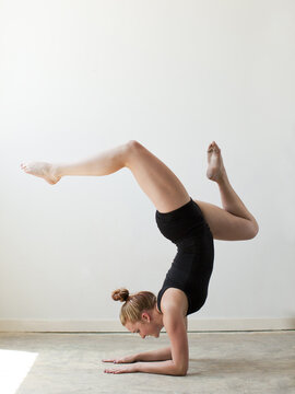 Teenage (16-17) gymnast exercising