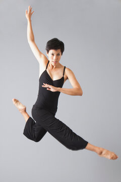 Studio Shot of jumping woman