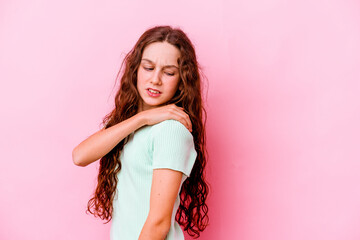 Little caucasian girl isolated on pink background having a shoulder pain.