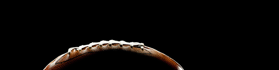 Leather ball for american football on black background