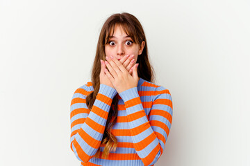 Young caucasian cute woman isolated on white background shocked covering mouth with hands.