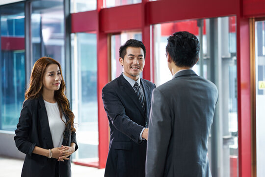 Happy Asian Business People Shaking Hands