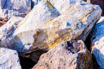 close up detail of rock surfaces in outdoors under natural sunlight 