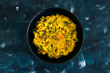 plant-based food, vegan turmeric risotto with pumpkin green beans and red pepper with dairy free sauce