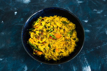 plant-based food, vegan turmeric risotto with pumpkin green beans and red pepper with dairy free sauce