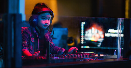 Fototapeta na wymiar little girl as music dj playing with music turntable in nightclub