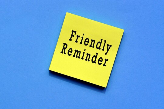 Friendly reminder text on yellow sticky note