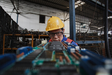 Electronic technician working. Repairman Check circuit board of electronic device