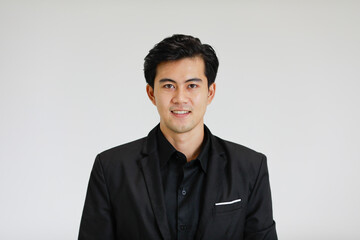 Portrait of young and handsome good looking Asian man on white background.