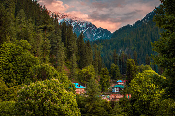 Scenic view in the Himalayan range. Sunrise view from the dense forest of Himalayan village  Grahan, Kasol, Himachal Pradesh, India.