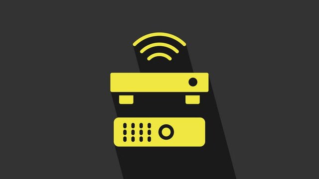 Yellow Wireless multimedia and TV box receiver and player with remote controller icon isolated on grey background. 4K Video motion graphic animation