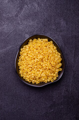 Dry pasta in a ceramic dish