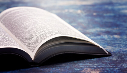 Bible Open on a Rustic Blue Wooden Table