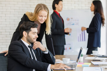 A group of diverse businesspeople working together in a modern office in an intimate manner. Idea for teamwork and good business colleagues