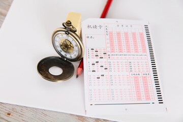 Chinese college entrance examination related answer cards, pencils and pocket watches