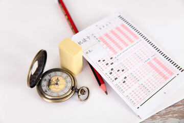 Chinese college entrance examination related answer cards, pencils and pocket watches