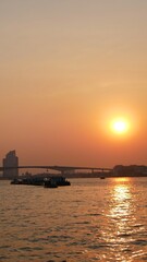 Beautiful landscape view from Chao Praya river during sunset, Bangkok, Thailand
