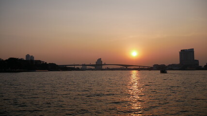Fototapeta na wymiar Beautiful landscape view from Chao Praya river during sunset, Bangkok, Thailand 