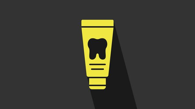 Yellow Tube of toothpaste icon isolated on grey background. 4K Video motion graphic animation