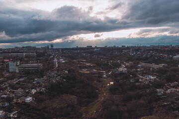 A bird's eye view of the dark blue sky over the city. Gloomy city