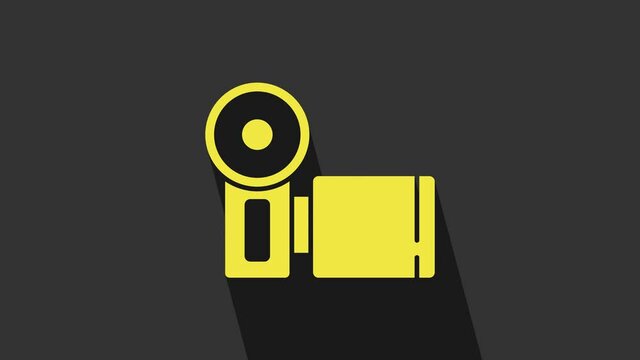 Yellow Cinema camera icon isolated on grey background. Video camera. Movie sign. Film projector. 4K Video motion graphic animation